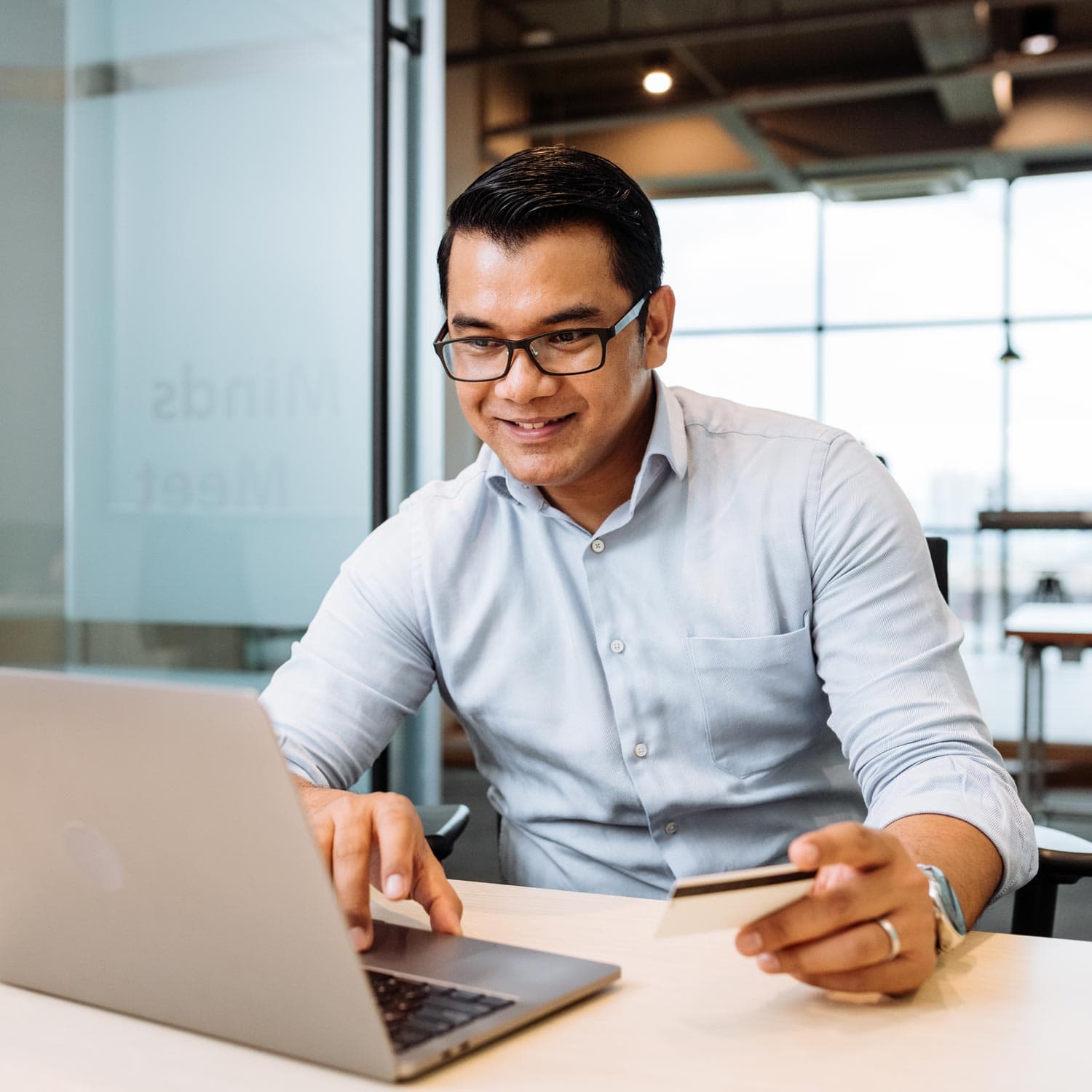 Man using a laptop smiling